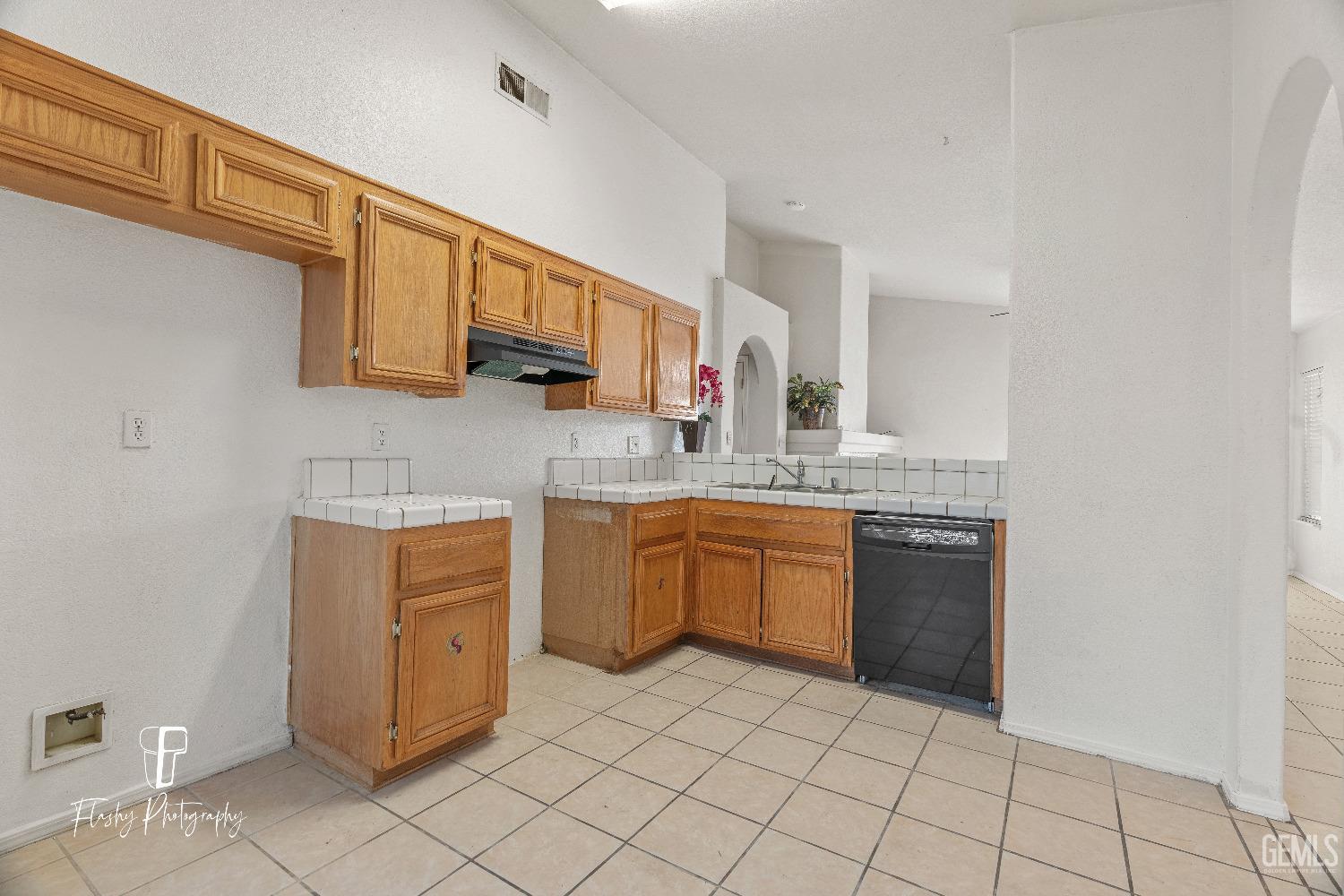 Undisclosed Address Bakersfield, CA 93313 - Photo 8 of 27 a kitchen with stainless steel appliances granite countertop a sink and cabinets