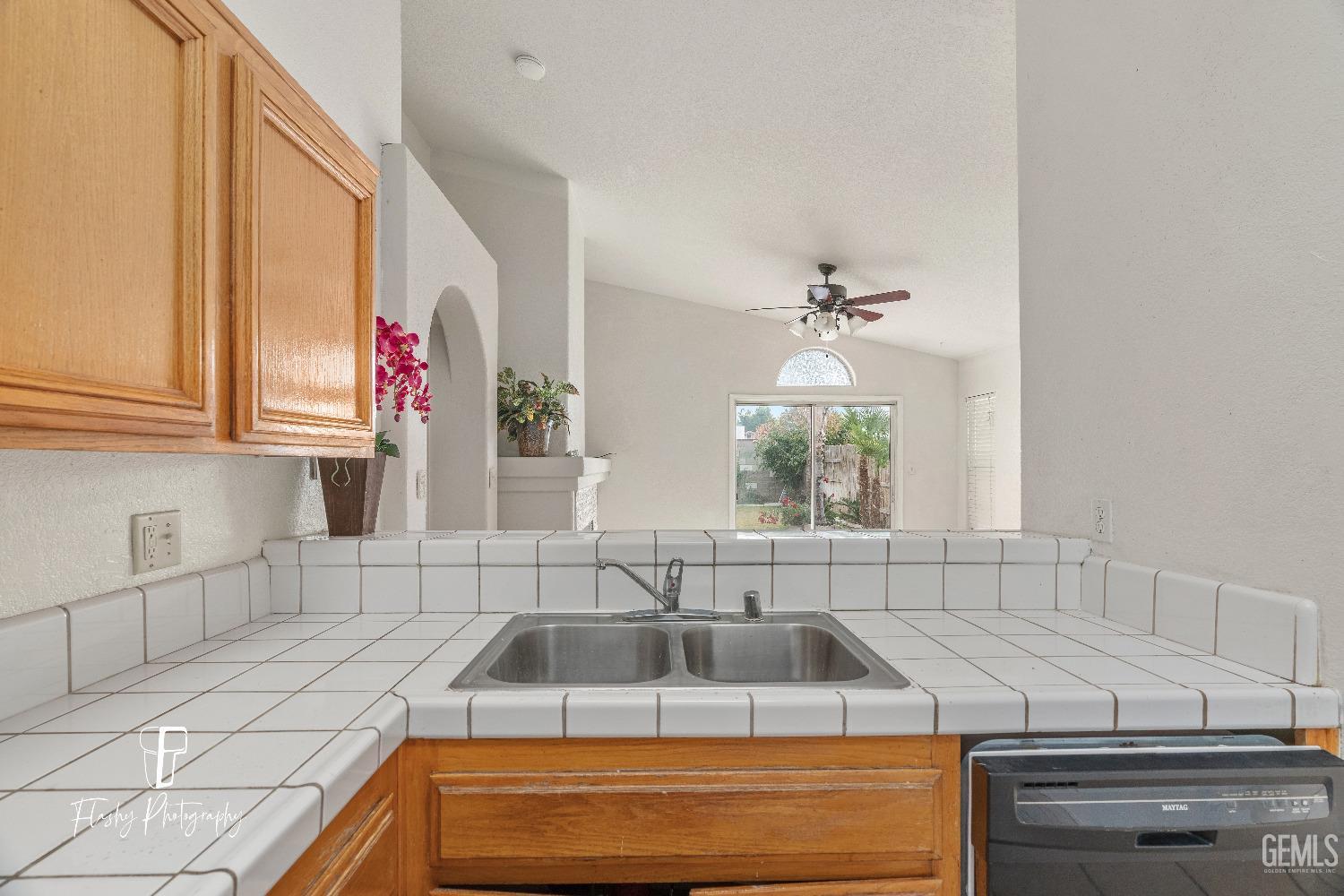 Undisclosed Address Bakersfield, CA 93313 - Photo 9 of 27 a kitchen with a sink and a stove top oven