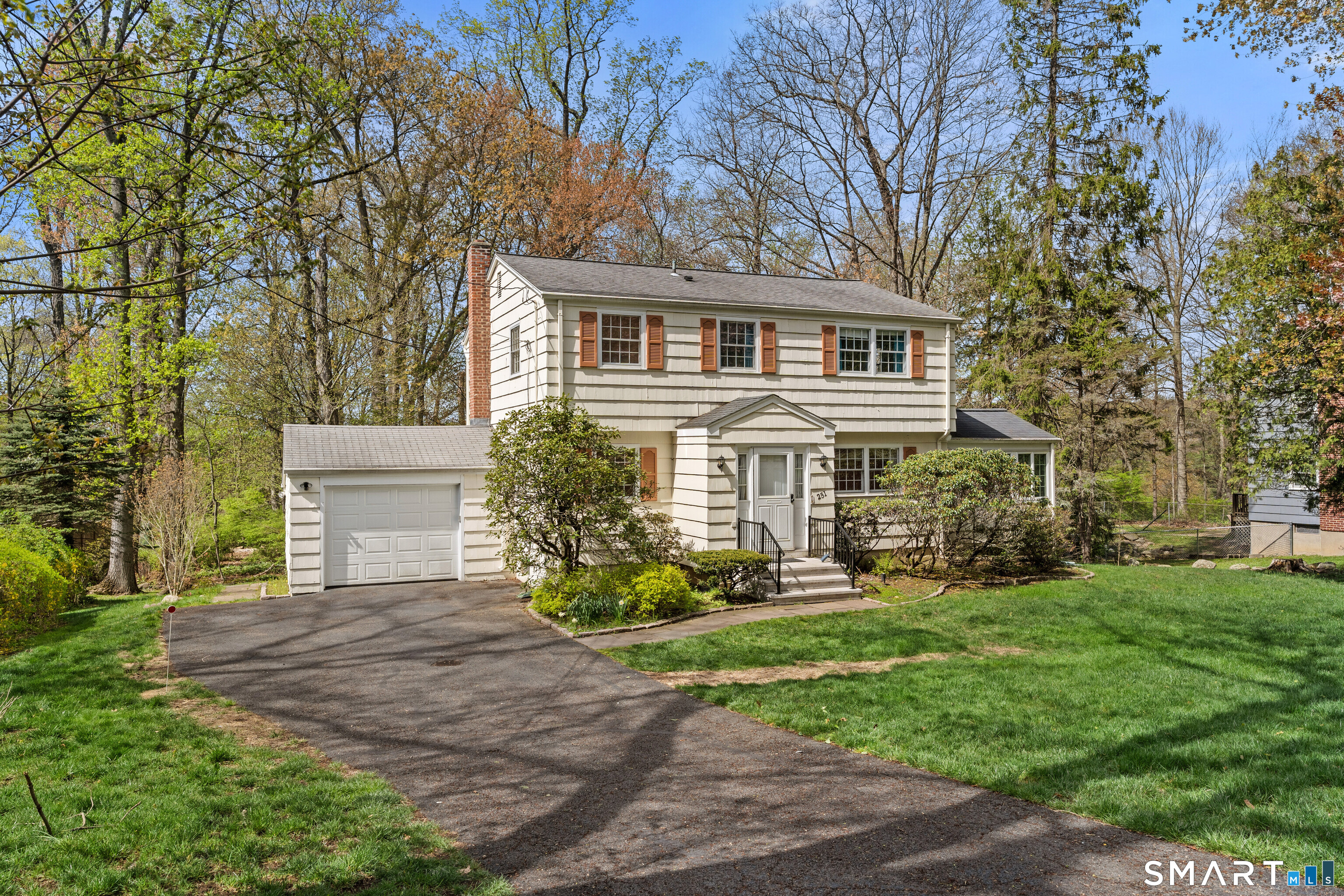 251 Shelter Rock Road Fairfield, CT 06825 - Photo 1 of 38 front view of a house with a yard