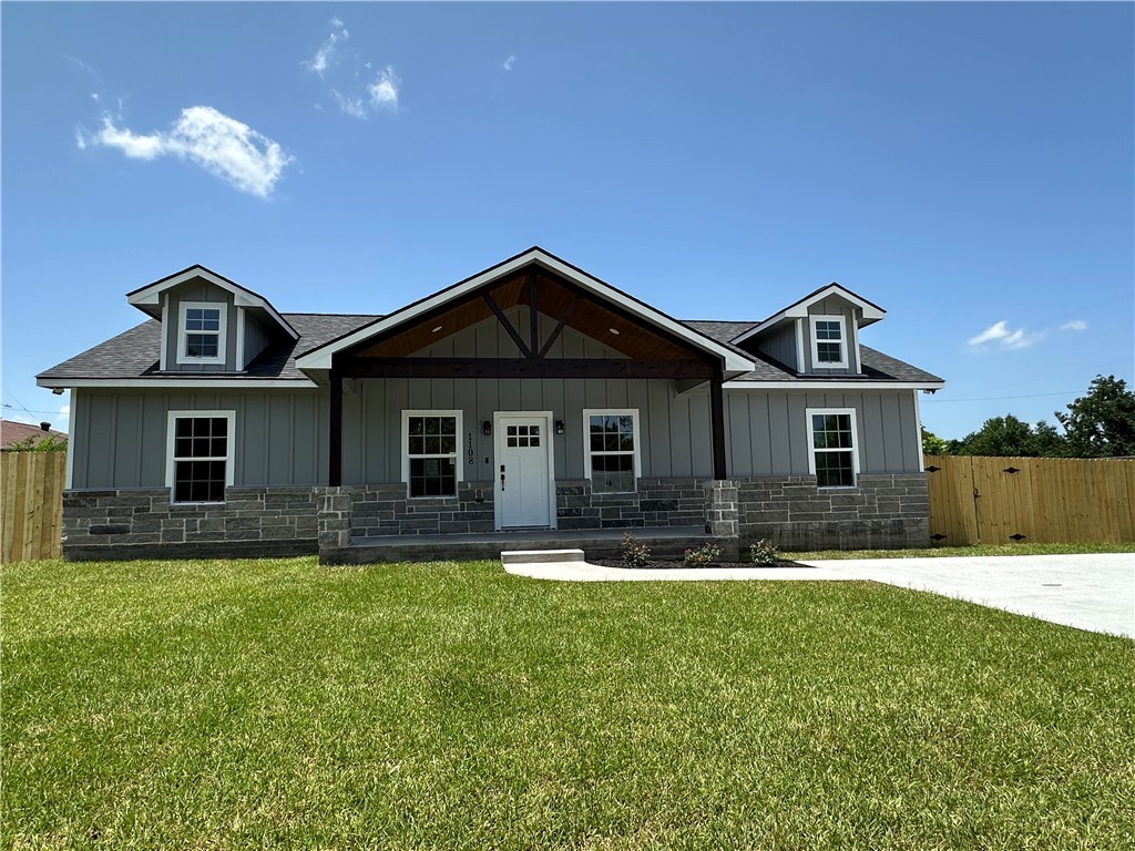 1108 North Preston Avenue Bryan, TX 77803 - Photo 1 of 1 a front view of a house with a yard and garage