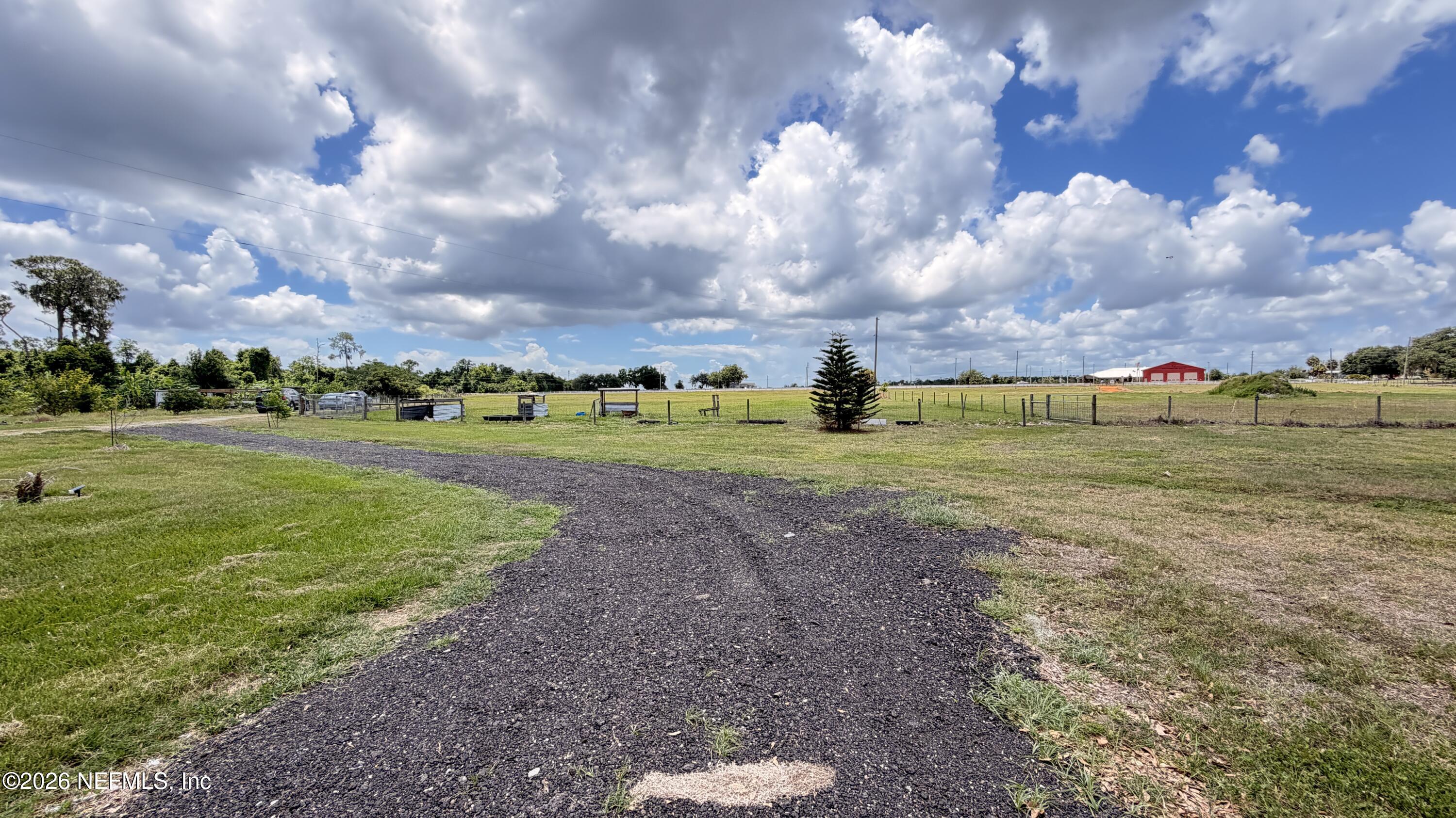 1302 Fort Meade Road Frostproof, FL 33843 - Photo 7 of 39 a view of a golf course with a lake