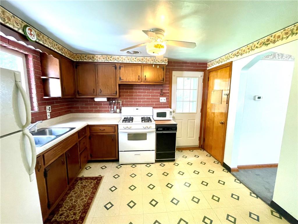 1010 5th Street Baden, PA 15005 - Photo 8 of 21 a kitchen with a sink appliances and cabinets