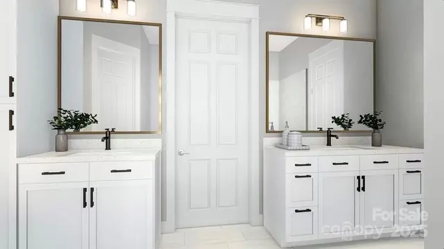 a bathroom with a sink vanity and a mirror