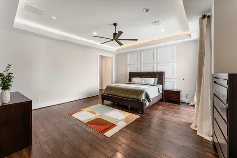 a living room with a bed furniture and a window
