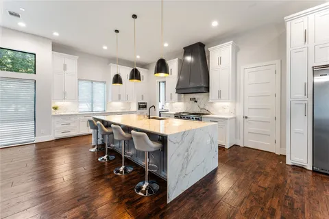 a view of cabinets and wooden floor