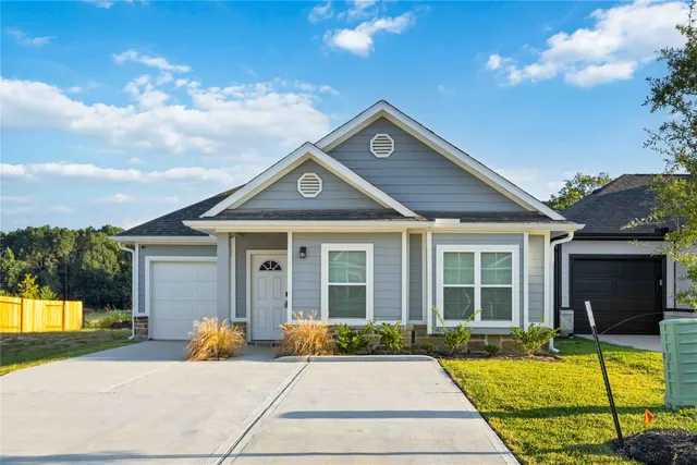 a view of a house with a swimming pool and sitting area