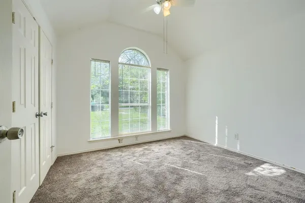 a view of an empty room with a window