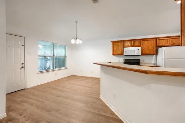 a view of a kitchen with a sink and cabinet area