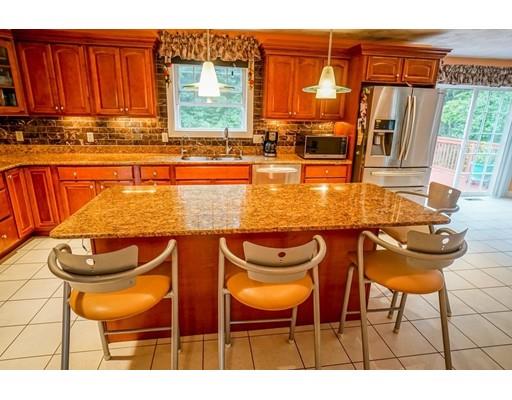18 Cobblestone Way Billerica, MA 01862 - Photo 15 of 30 a view of a swimming pool with a table and chairs