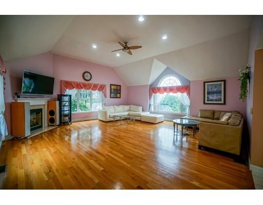 18 Cobblestone Way Billerica, MA 01862 - Photo 18 of 30 a living room with fireplace furniture and a flat screen tv