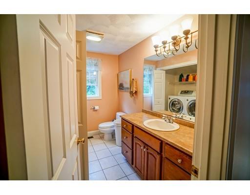 18 Cobblestone Way Billerica, MA 01862 - Photo 20 of 30 a bathroom with a sink a mirror a vanity and a shower