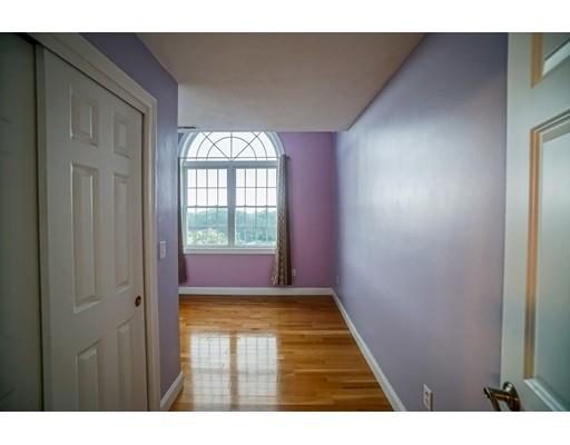 18 Cobblestone Way Billerica, MA 01862 - Photo 21 of 30 a view of an empty room with wooden floor and a window