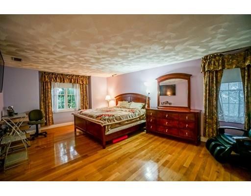 18 Cobblestone Way Billerica, MA 01862 - Photo 22 of 30 a spacious bedroom with a bed dresser and a window