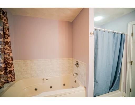18 Cobblestone Way Billerica, MA 01862 - Photo 25 of 30 a bathroom with a shower and a tub