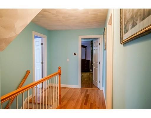 18 Cobblestone Way Billerica, MA 01862 - Photo 27 of 30 a view of a hallway with wooden floor and staircase