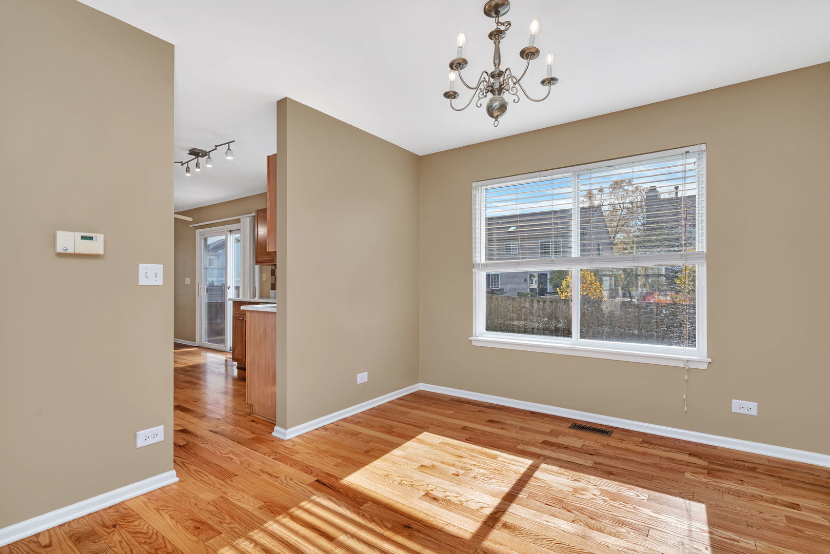 2509 Rosehall Lane Aurora, IL 60503 - Photo 12 of 51 a view of empty room with wooden floor and fan