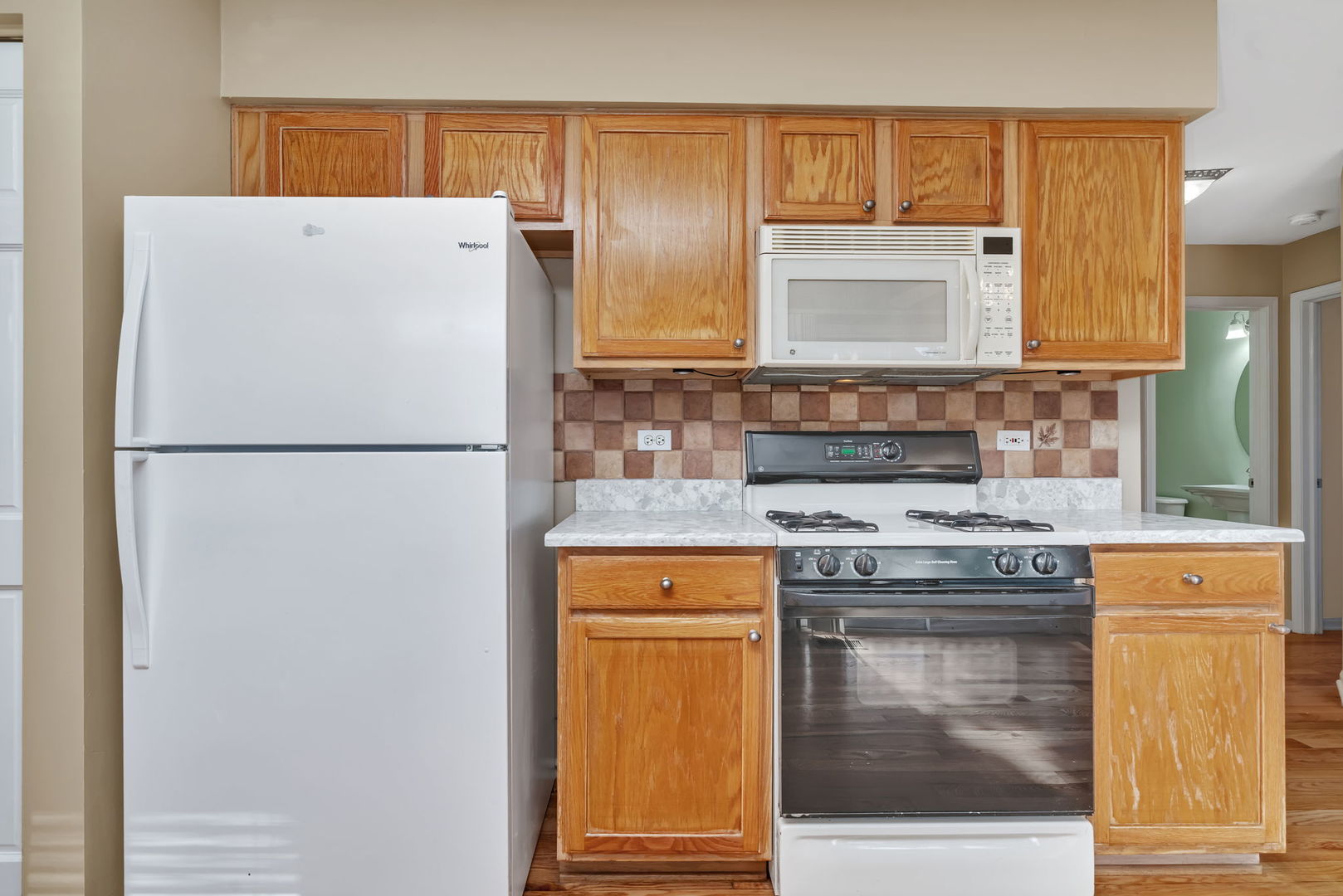 2509 Rosehall Lane Aurora, IL 60503 - Photo 18 of 51 a kitchen with a stove top oven and refrigerator