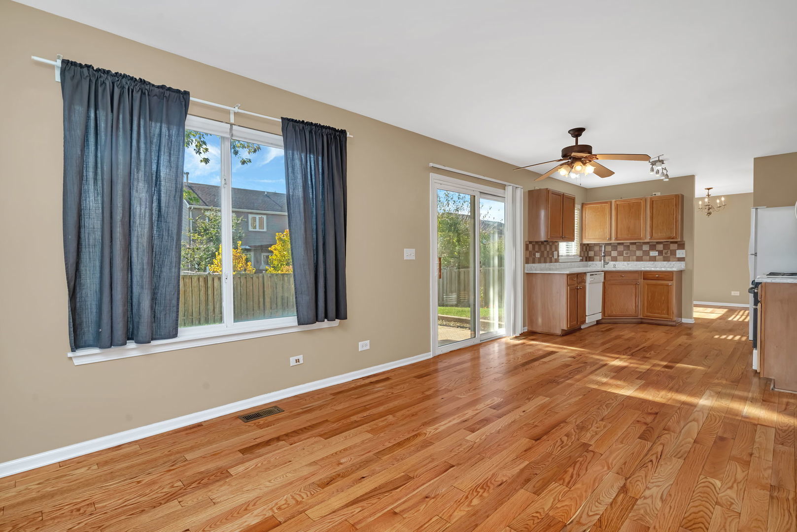 2509 Rosehall Lane Aurora, IL 60503 - Photo 25 of 51 a view of an empty room with a window and wooden floor