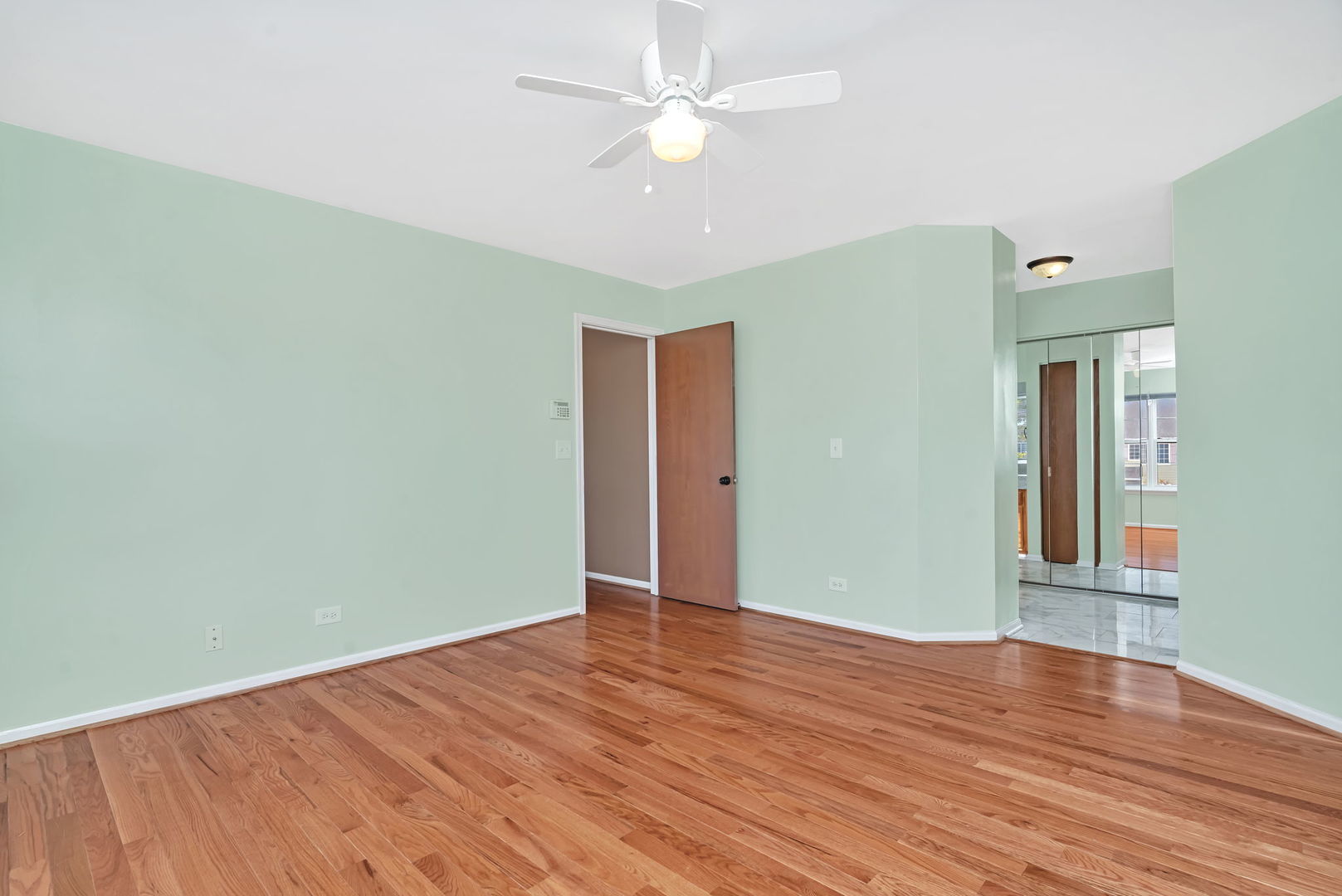 2509 Rosehall Lane Aurora, IL 60503 - Photo 27 of 51 wooden floor in an empty room with a window