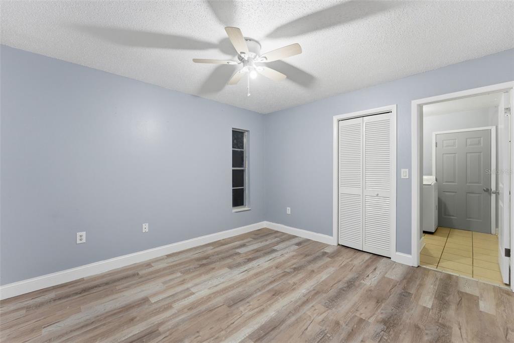 6211 Lorraine Lane Spring Hill, FL 34608 - Photo 21 of 28 an empty room with fan and windows