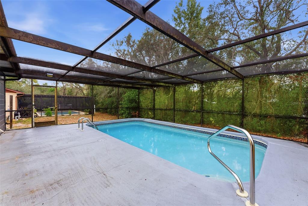 6211 Lorraine Lane Spring Hill, FL 34608 - Photo 24 of 28 a view of swimming pool with a patio