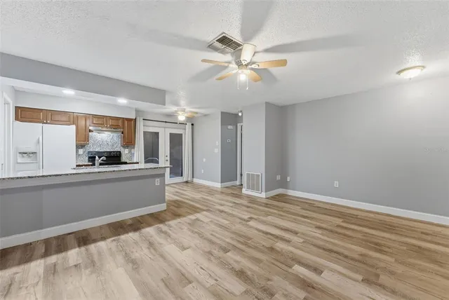 a view of a kitchen with a sink and a window
