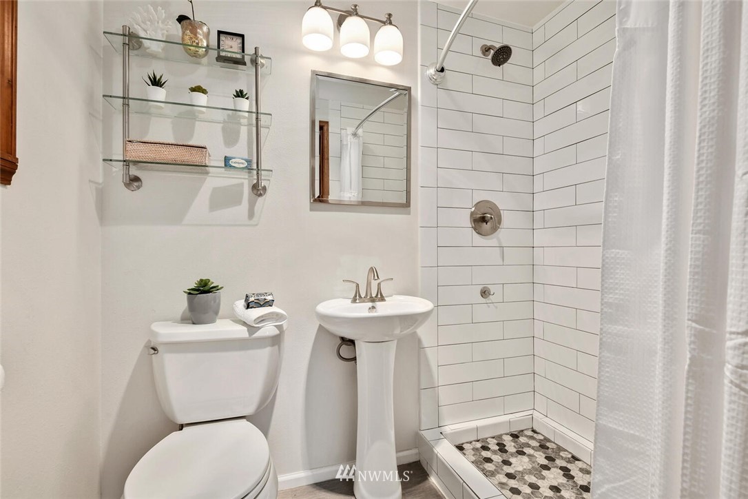 6 234th Place Southeast Bothell, WA 98021 - Photo 22 of 28 a bathroom with a sink a toilet and shower