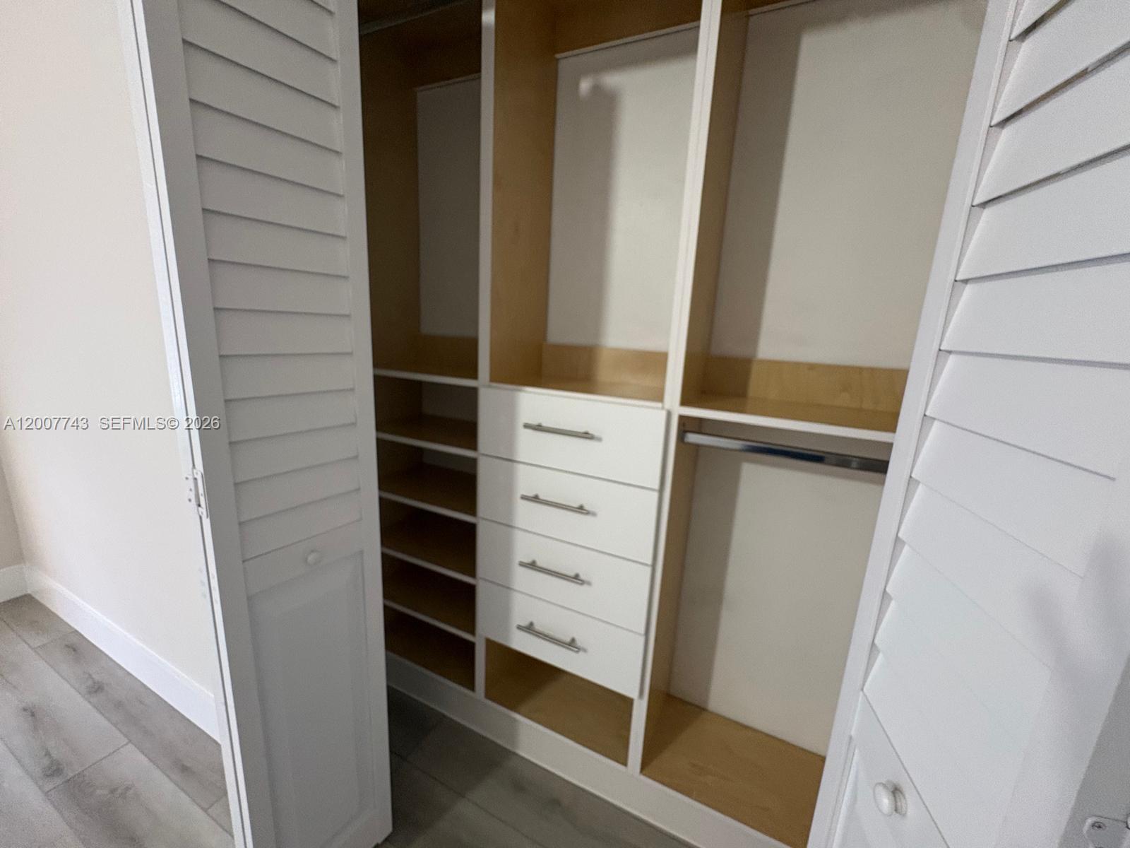 15250 Southwest 80th Street, Unit 4 Miami, FL 33193 - Photo 15 of 18 a view of walk in closet