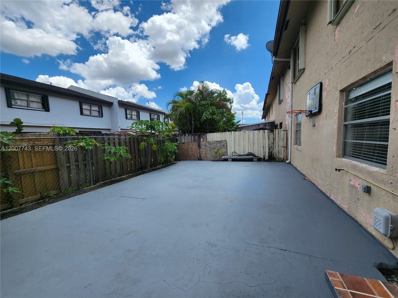 15250 Southwest 80th Street, Unit 4 Miami, FL 33193 - Photo 17 of 18 a view of a house with a street