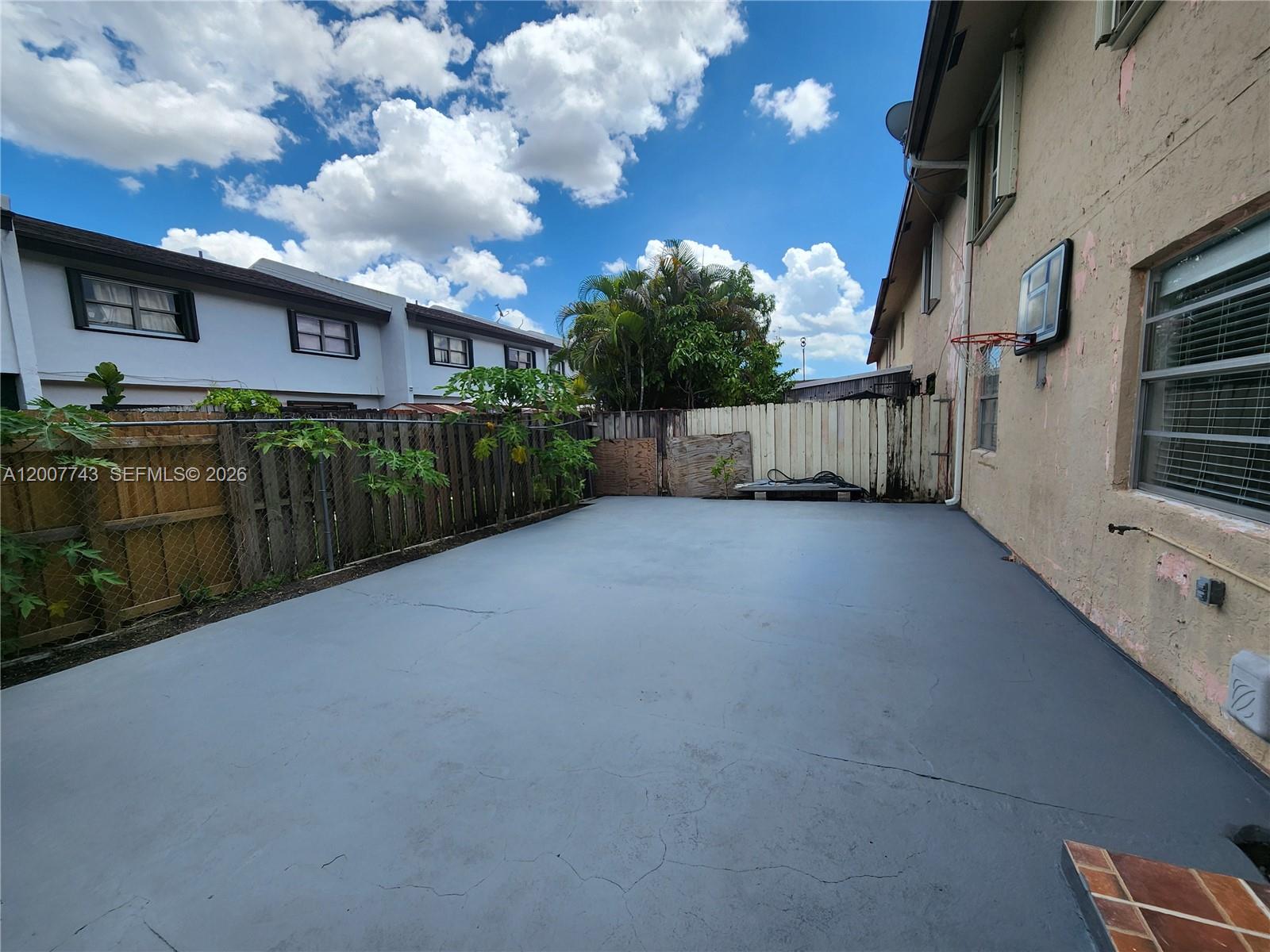 15250 Southwest 80th Street, Unit 4 Miami, FL 33193 - Photo 18 of 18 a view of a house with a yard