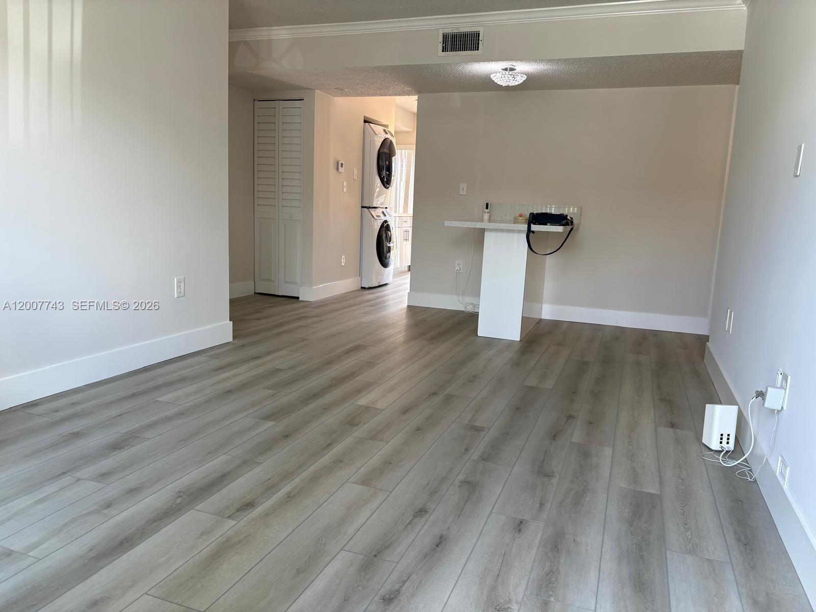 15250 Southwest 80th Street, Unit 4 Miami, FL 33193 - Photo 5 of 18 wooden floor in an empty room