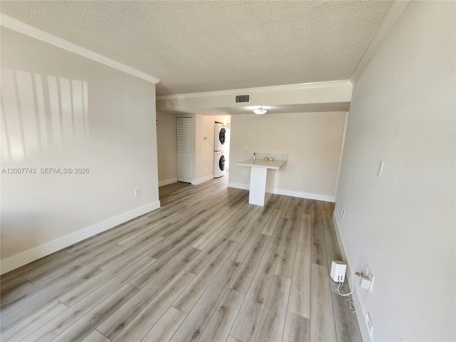 15250 Southwest 80th Street, Unit 4 Miami, FL 33193 - Photo 6 of 18 a view of empty room with wooden floor