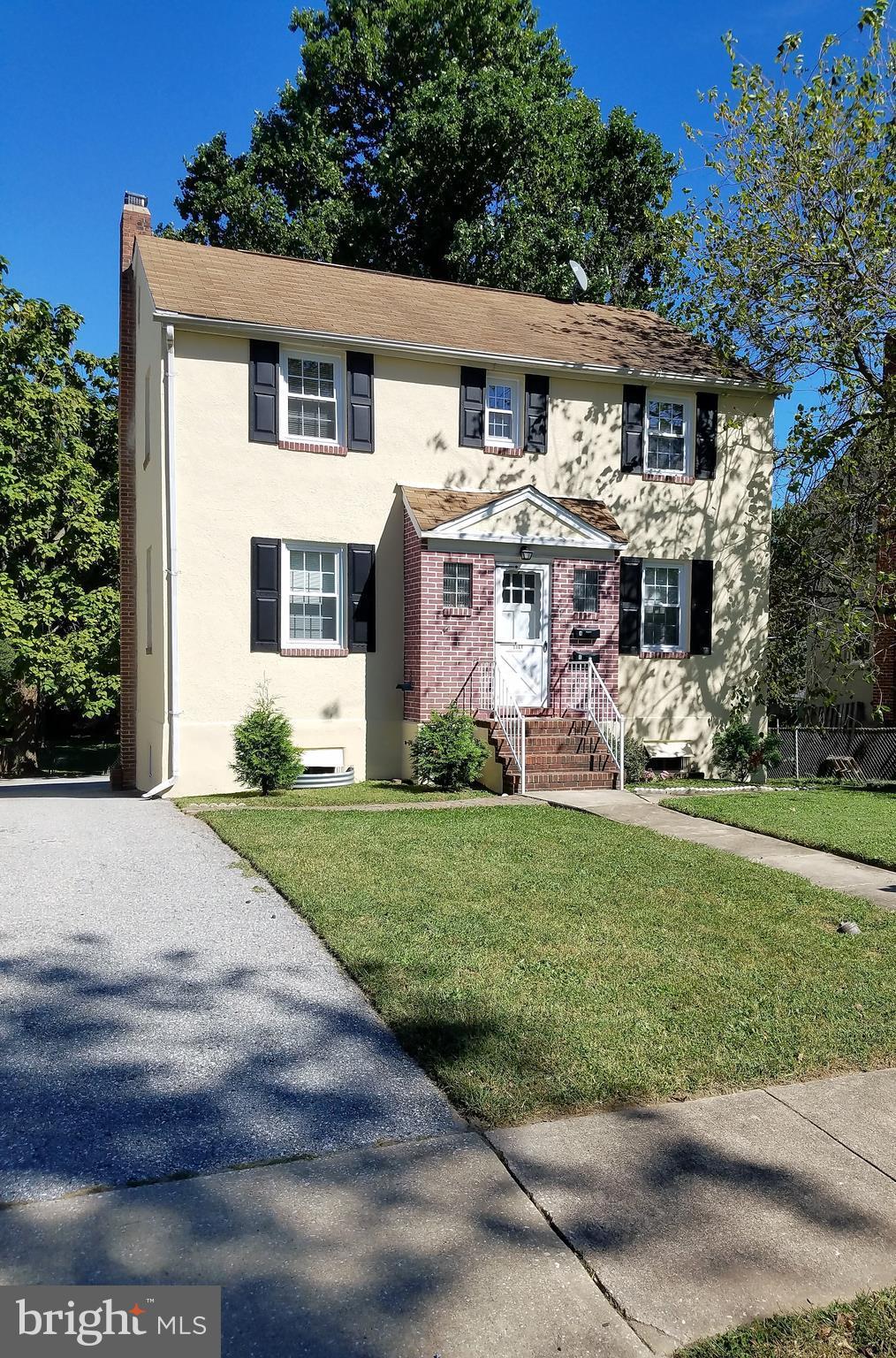 5561 Ashbourne Road Halethorpe, MD 21227 - Photo 1 of 21 a front view of house with yard and green space