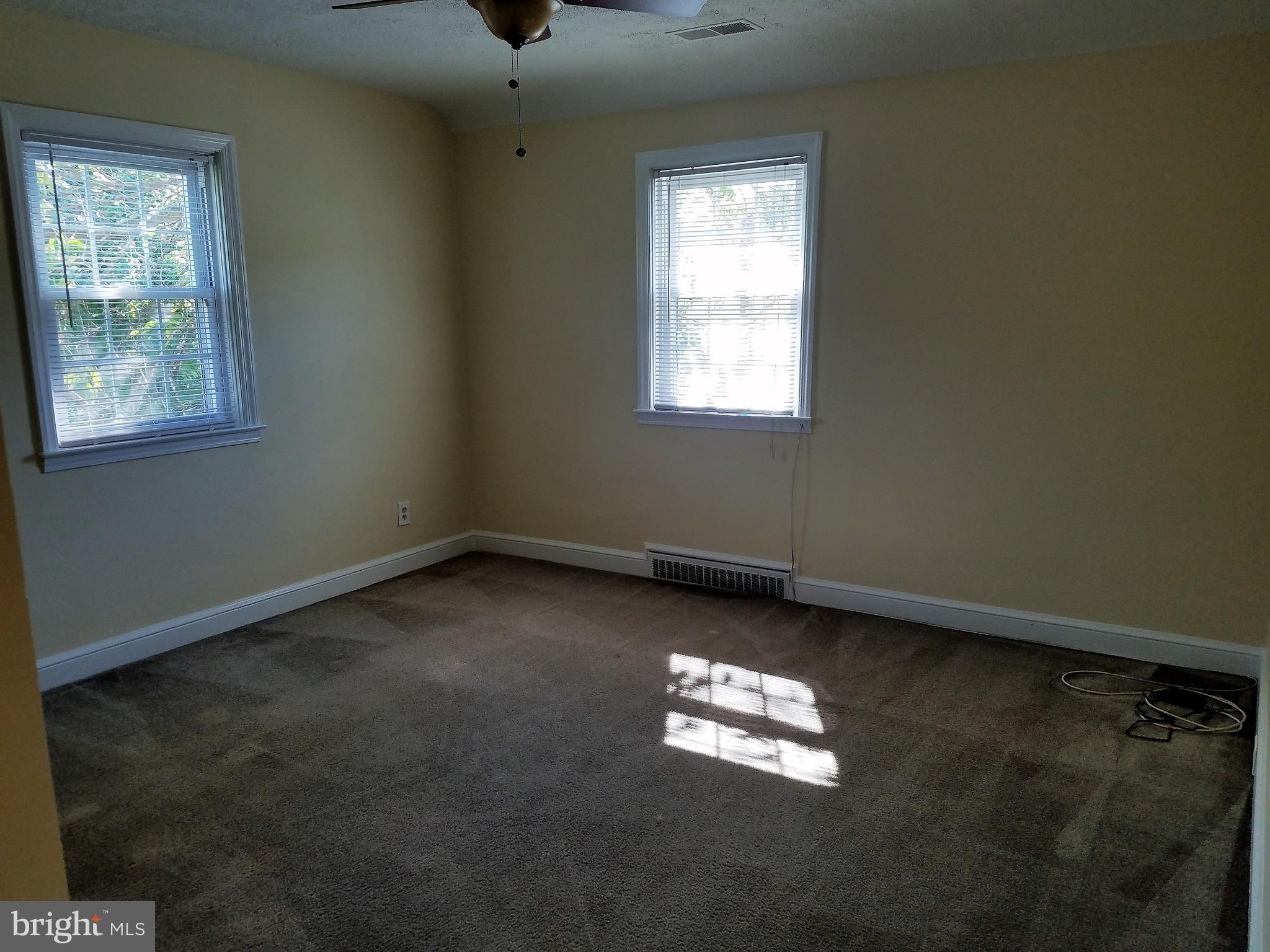 5561 Ashbourne Road Halethorpe, MD 21227 - Photo 12 of 21 an empty room with a window