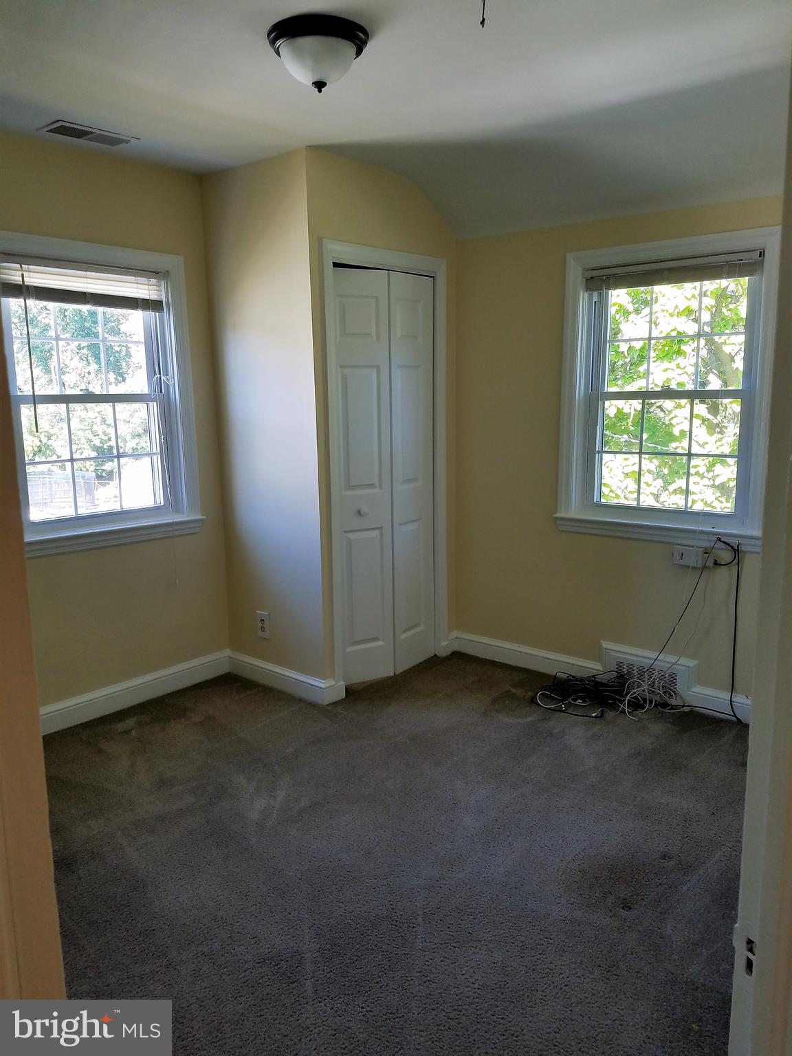 5561 Ashbourne Road Halethorpe, MD 21227 - Photo 16 of 21 an empty room with windows