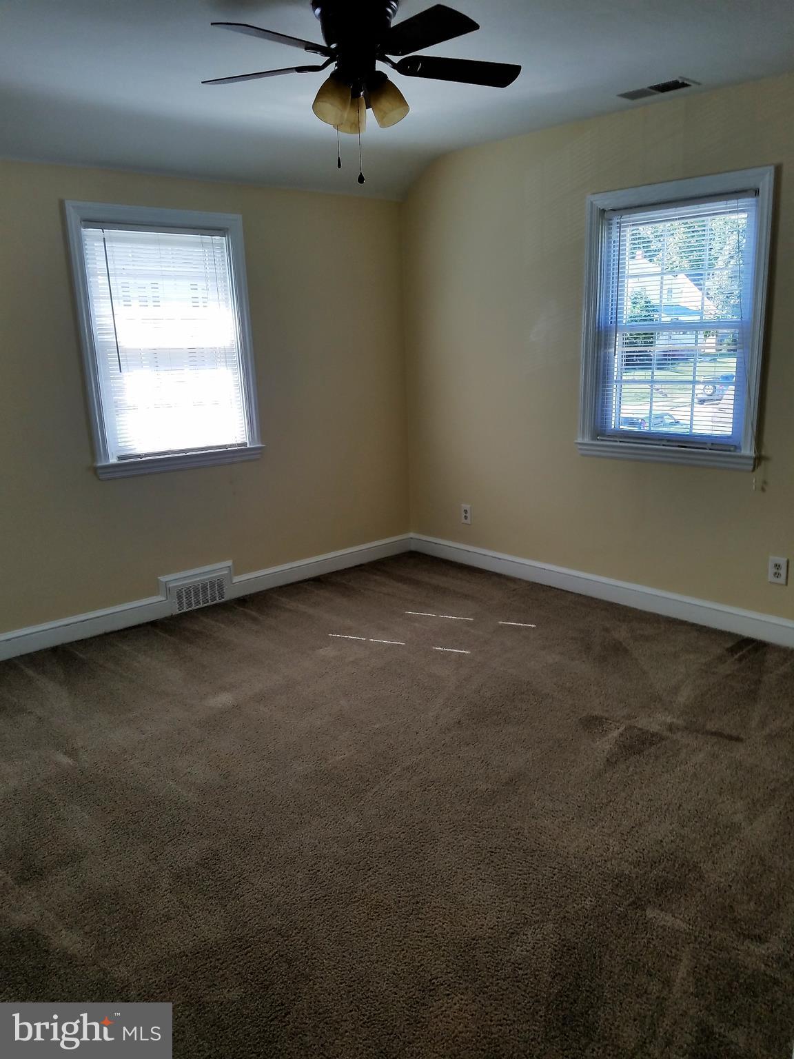 5561 Ashbourne Road Halethorpe, MD 21227 - Photo 17 of 21 an empty room with a window