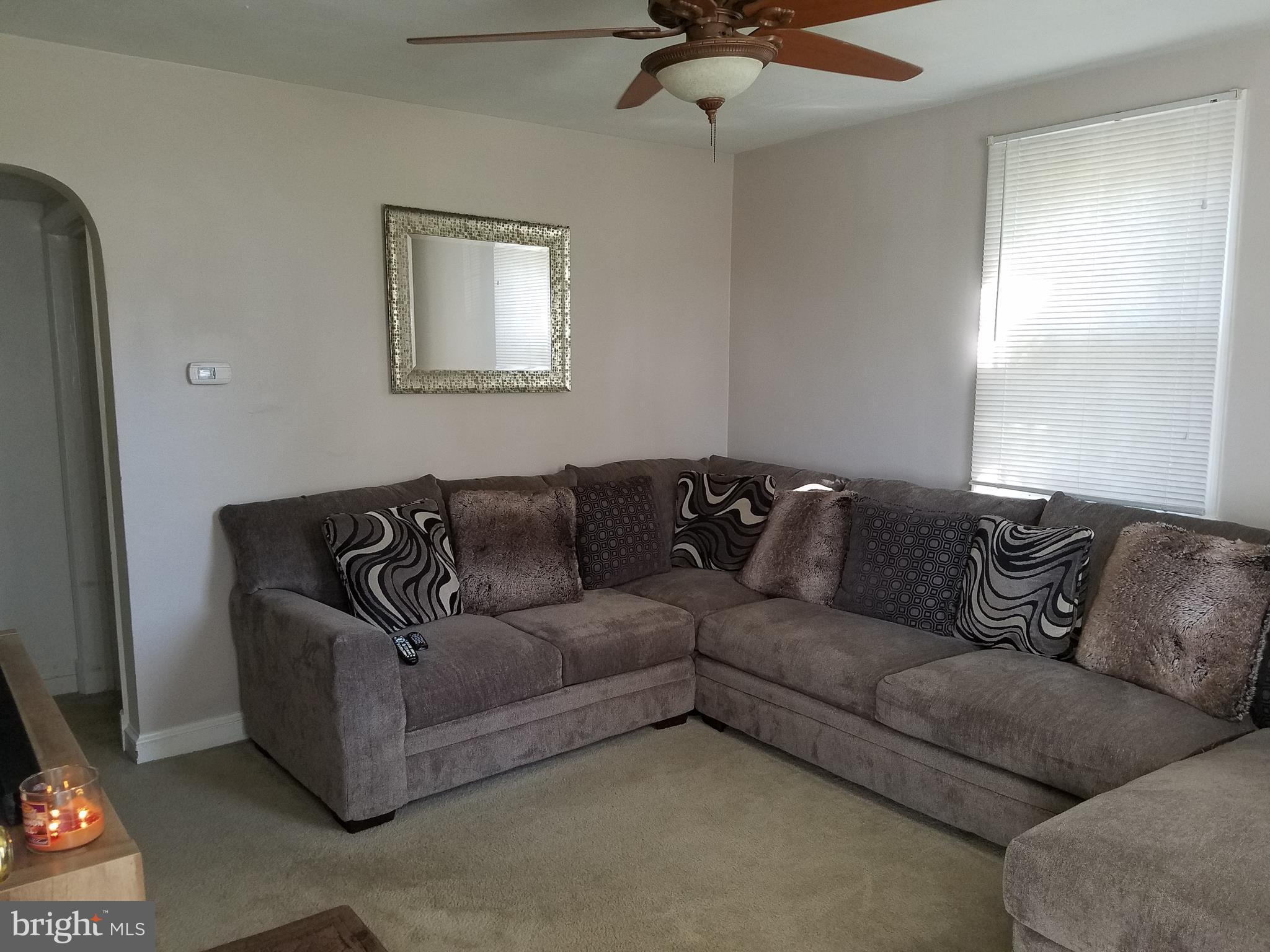 5561 Ashbourne Road Halethorpe, MD 21227 - Photo 3 of 21 a living room with a couch