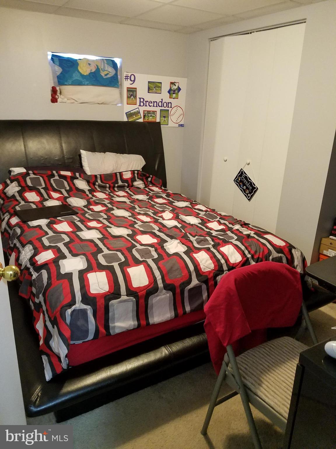 5561 Ashbourne Road Halethorpe, MD 21227 - Photo 7 of 21 a bedroom with a bed and window