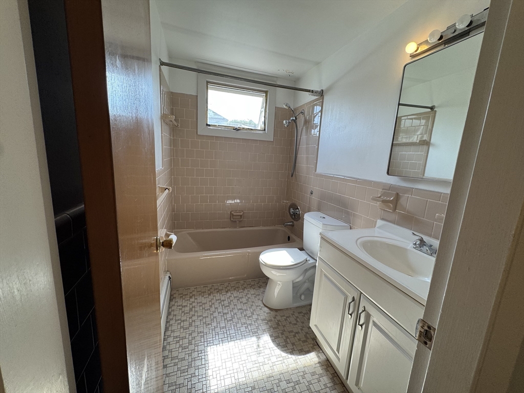 100 Magnolia Avenue, Unit 5 Lynn, MA 01904 - Photo 12 of 16 a bathroom with a sink toilet and shower