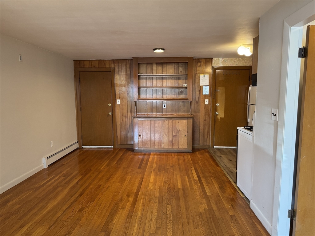100 Magnolia Avenue, Unit 5 Lynn, MA 01904 - Photo 5 of 16 a view of empty room with wooden floor