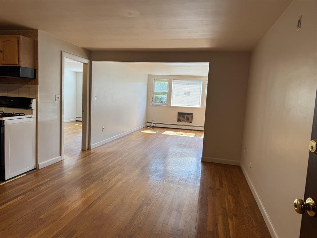 100 Magnolia Avenue, Unit 5 Lynn, MA 01904 - Photo 8 of 16 a view of empty room with wooden floor