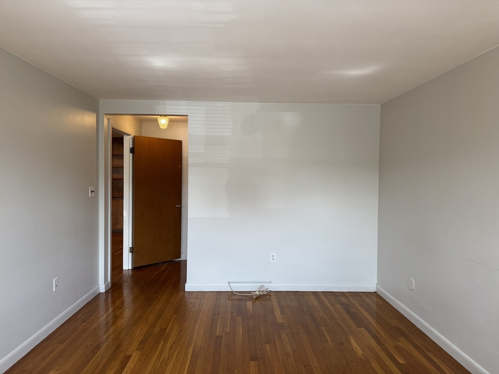 100 Magnolia Avenue, Unit 5 Lynn, MA 01904 - Photo 10 of 16 a view of empty room with wooden floor
