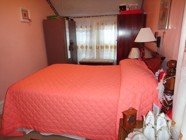 89 Spring Street Fairhaven, MA 02719 - Photo 11 of 27 a bed room with a bed and a lamp