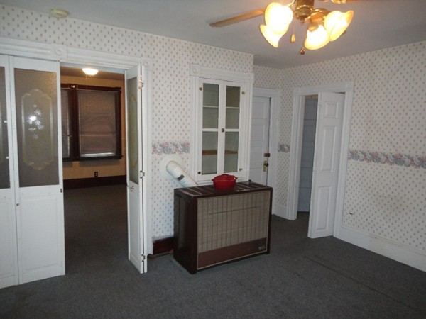 89 Spring Street Fairhaven, MA 02719 - Photo 19 of 27 a living room with furniture and a window