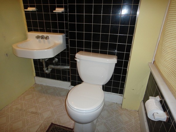 89 Spring Street Fairhaven, MA 02719 - Photo 24 of 27 a bathroom with a toilet a sink and mirror