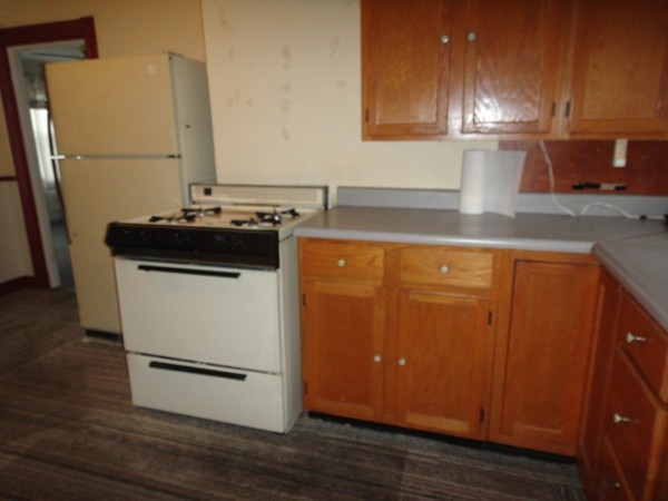 89 Spring Street Fairhaven, MA 02719 - Photo 27 of 27 a kitchen with a sink and a refrigerator