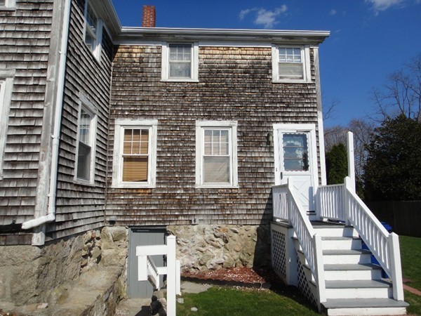 89 Spring Street Fairhaven, MA 02719 - Photo 3 of 27 a front view of a house with a yard