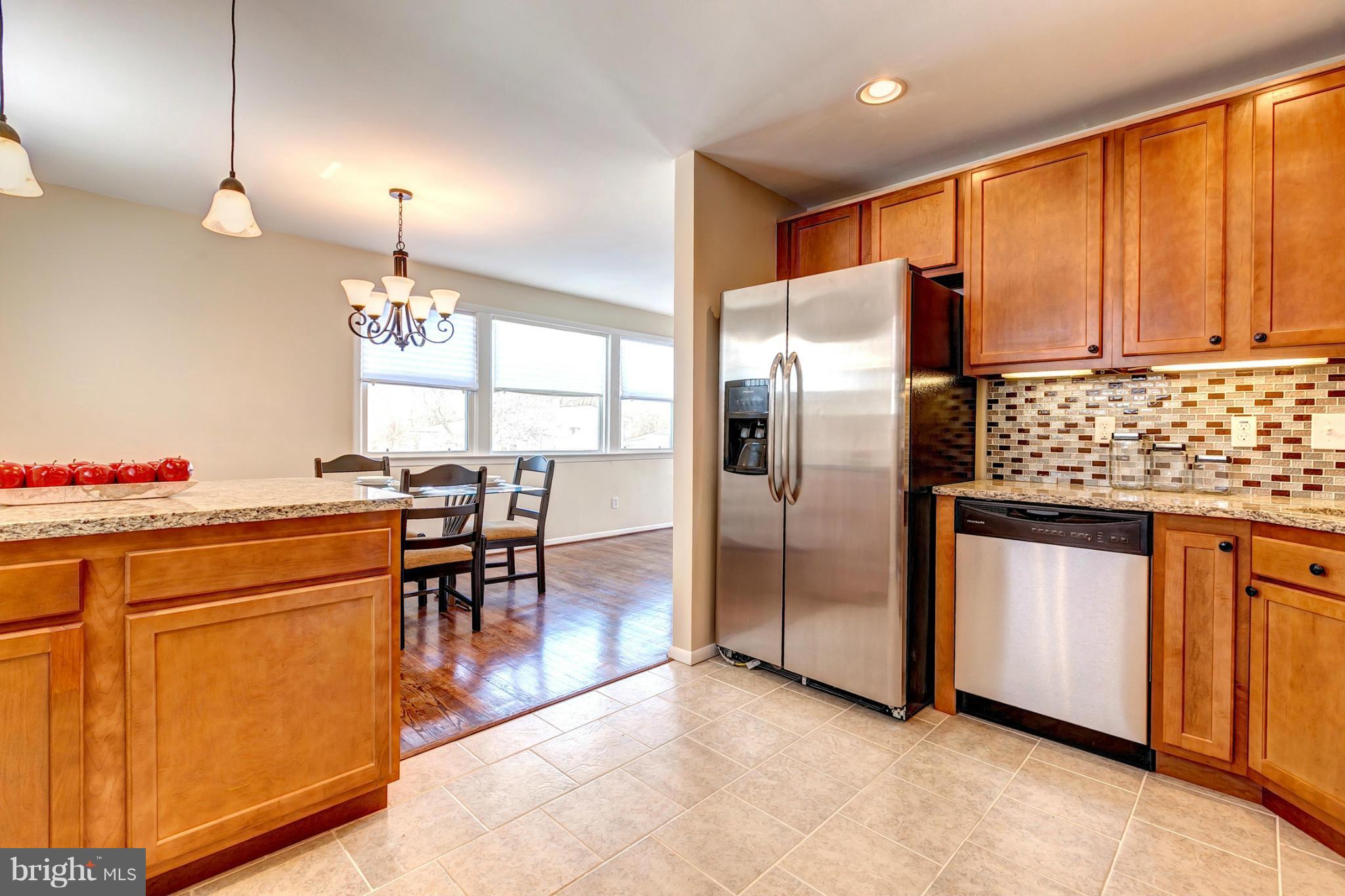 8417 Billson Road Randallstown, MD 21133 - Photo 10 of 29 Kitchen With Custom Tile Backsplash