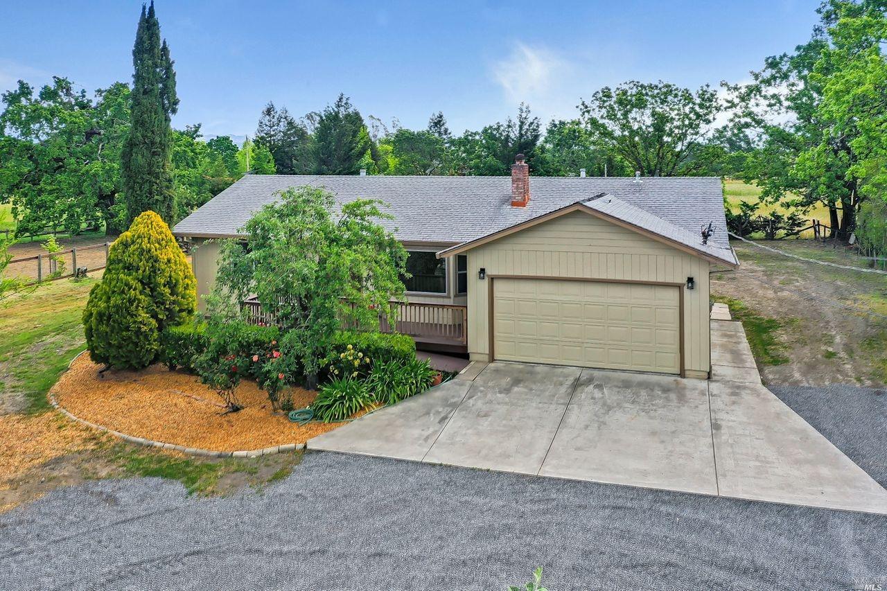 538 Irwin Lane Santa Rosa, CA 95401 - Photo 1 of 1 a view of a house with a yard and garage