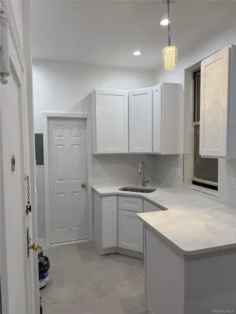 a kitchen with a sink and cabinets